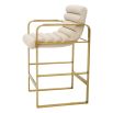cream linen upholstered counter stool with horizontal fluting and brass frame