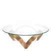 Curvaceous trio-legged coffee table in brass with round glass top