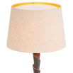 Bronze highlight finish floor lamp with layered silhouette completed with a shade