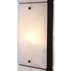 alabaster and bronze finish, with light warmly diffusing through the base for an inviting glow