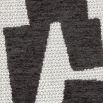 Dining chair with black and white abstract design and black legs