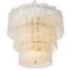 Divine and opulent chandelier featuring textured layered grass and brushed brass accents