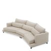 A luxury sofa by Eichholtz with a grey upholstery and modern design