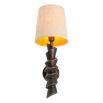 Wall lamp with angular silhouette and linen shade