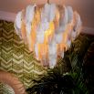 Inspired by the banana tree, the Saint Lucia Chandelier blends ceramic and textured glass, creating a unique and elegant focal point.