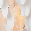 Inspired by the banana tree, the Saint Lucia Chandelier blends ceramic and textured glass, creating a unique and elegant focal point.