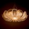 The Cabrillo Chandelier combines textured glass and an antique brass finish, offering a timeless and sophisticated statement for your interior.