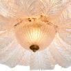 The Cabrillo Chandelier combines textured glass and an antique brass finish, offering a timeless and sophisticated statement for your interior.