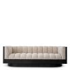 Upholstered sofa with fluted seating and black wood encompassing edge