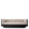 Upholstered sofa with fluted seating and black wood encompassing edge