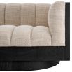 Upholstered sofa with fluted seating and black wood encompassing edge