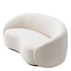 Off white sofa with curved back and a sleek black base