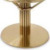 Contemporary bar stool with brass finish base and velvet grey seat