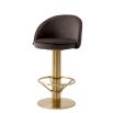 Contemporary counter stool with brass finish base and velvet grey seat