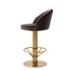 Contemporary counter stool with brass finish base and velvet grey seat