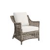 Hand-braided brown wicker armchair perfect for outdoor use