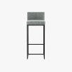 A luxurious tall bar stool in Lars Atlantic with an iron base