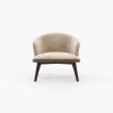 A chic, Mid-Century inspired armchair with two materials and contrasting black ash legs  