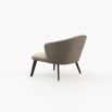 A chic, Mid-Century inspired armchair with two materials and contrasting black ash legs  