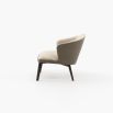A chic, Mid-Century inspired armchair with two materials and contrasting black ash legs  