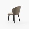 A luxurious dining chair upholstered in two sumptuous fabrics by Laskasas