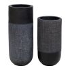 Elevate your decor with these black terracotta vases, blending earthy craftsmanship and modern design with woven accents for rustic elegance.