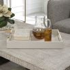 A sophisticated faux shagreen tray with beautiful brass details