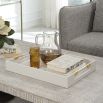 A sophisticated faux shagreen tray with beautiful brass details
