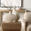 Set of two vases with ribbed design and asymmetric silhouette.