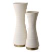 Ridged cream vases with curvaceous silhouette.