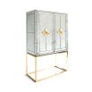 An elegant antiqued glass and polished brass maximalist bar
