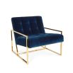 A modern navy lounge chair with a polished brass frame