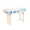 A futuristic white console table with blue acrylic cabochons and a polished brass base 