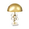 A polished brass table lamp with acrylic globes and a marble base 