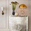 A polished brass table lamp with acrylic globes and a marble base 