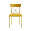 A luxurious vintage style dining chair with polished brass accents