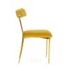 A luxurious vintage style dining chair with polished brass accents