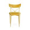 A luxurious vintage style dining chair with polished brass accents