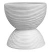 White side table with ribbed detailing in rattan
