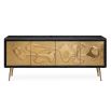 A brutalist inspired black and hand-hammered brass credenza 