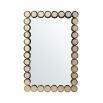 A luxurious, brass wall mirror with mother of pearl embellishments 