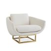 modern luxe armchair with ivory boucle upholstery and polished brass base