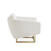 modern luxe armchair with ivory boucle upholstery and polished brass base