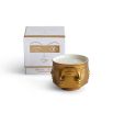 Golden ceramic candle by Jonathan Adler with faces 