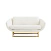 boucle upholstered sofa with a polished brass base 