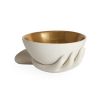 A luxurious hand-shaped bowl with gold interior detailing