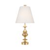 A modernised traditional table lamp in polished brass