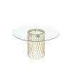 A modern dining table with an art deco-inspired golden base and round glass tabletop