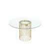 A modern dining table with an art deco-inspired golden base and round glass tabletop