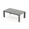 A luxurious, sculptural extendable dining table in a matte grey eucalyptus finish